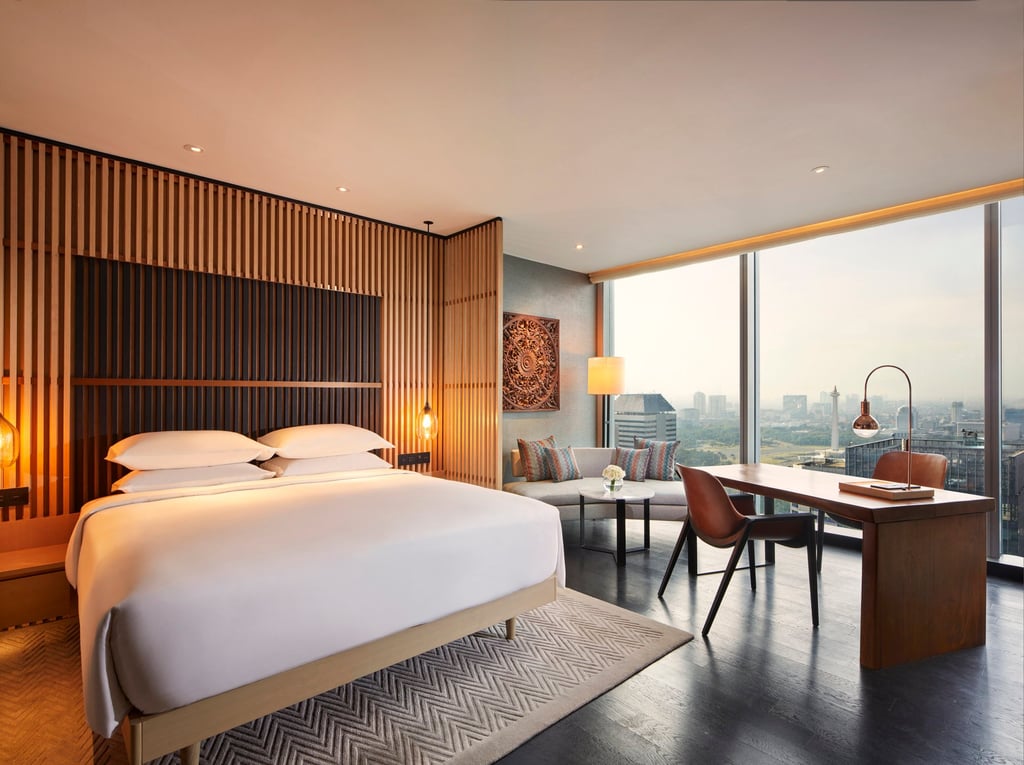 A king bedroom at Park Hyatt Jakarta overlooking the National Monument Park. Photo: Handout