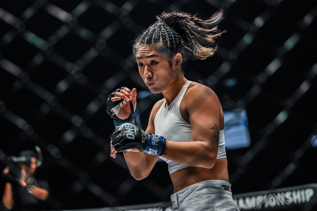 Angela Lee in a strawweight title fight with Xiong Jingnan. Angela Lee in a strawweight title fight with Xiong Jingnan.