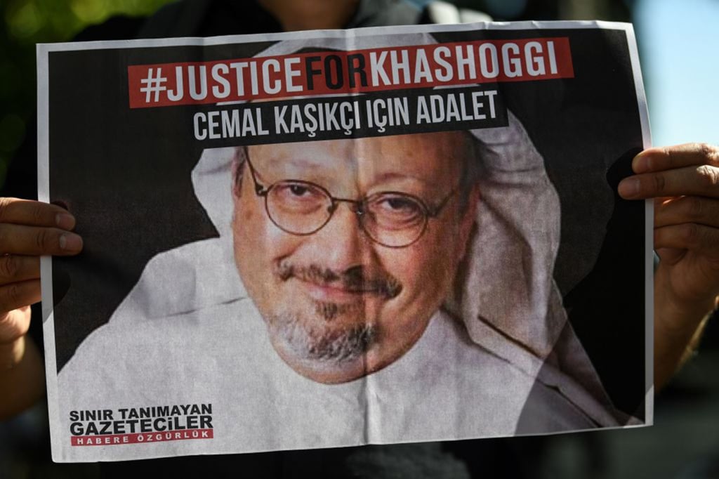 A friend of murdered Saudi journalist Jamal Khashoggi holds a poster bearing his picture at an event in October 2020 in front of Saudi Arabia’s consulate in Istanbul marking the second-year anniversary of his assassination. Photo: TNS A friend of murdered Saudi journalist Jamal Khashoggi holds a poster bearing his picture at an event in October 2020 in front of Saudi Arabia’s consulate in Istanbul marking the second-year anniversary of his assassination. Photo: TNS