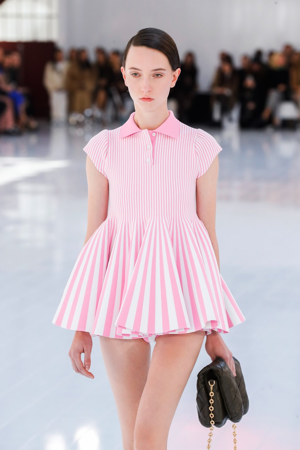 A model wears a striped pink minidress from the spring/summer 2023 ready-to-wear collection during the Paris Fashion Week on September 30. Photo: EPA-EFE A model wears a striped pink minidress from the spring/summer 2023 ready-to-wear collection during the Paris Fashion Week on September 30. Photo: EPA-EFE