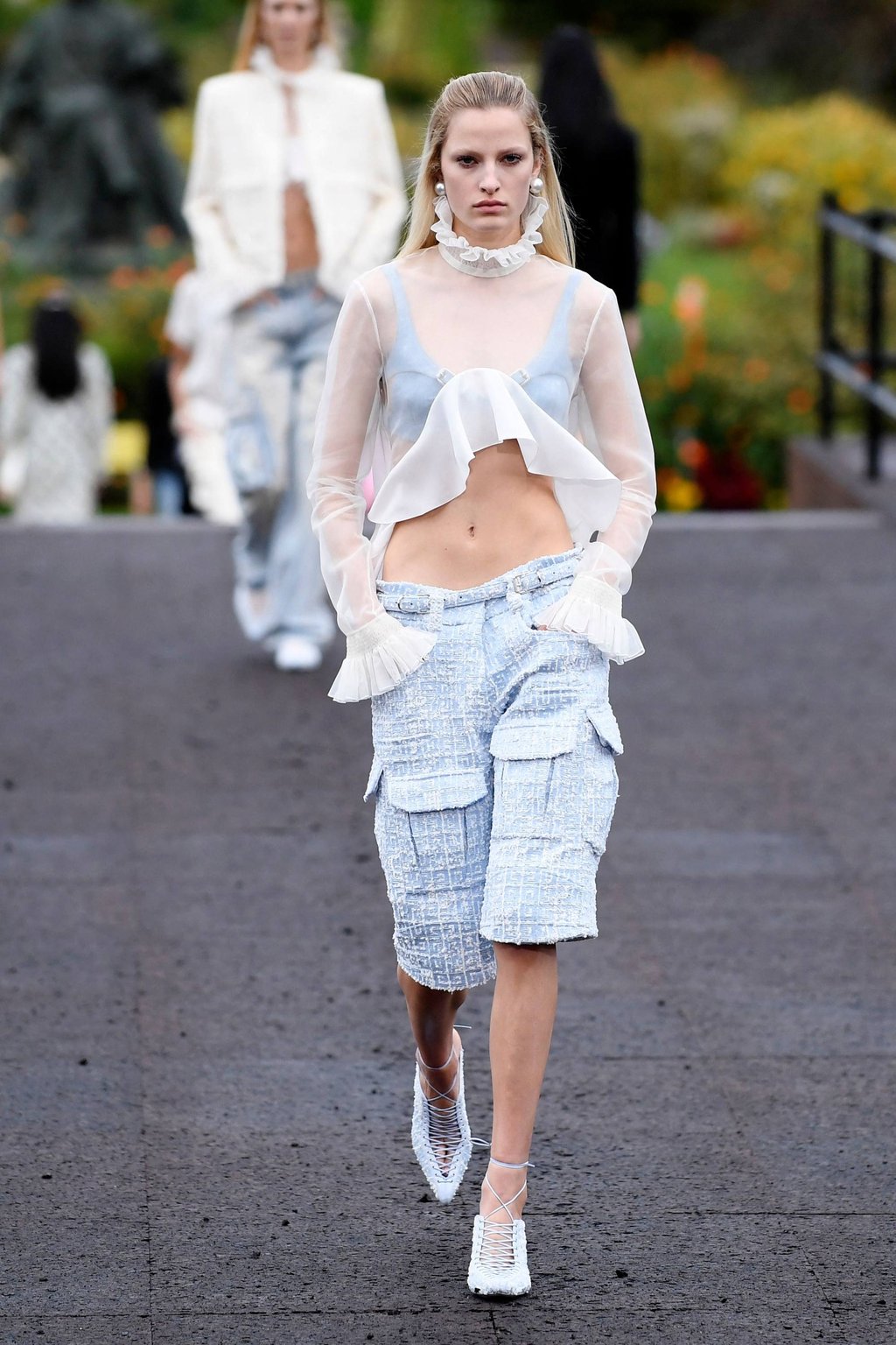 A model presents a translucent creation for Givenchy during the spring-summer 2023 fashion show as part of the Paris Womenswear Fashion Week, in Paris, on October 2. Photo: AFP A model presents a translucent creation for Givenchy during the spring-summer 2023 fashion show as part of the Paris Womenswear Fashion Week, in Paris, on October 2. Photo: AFP