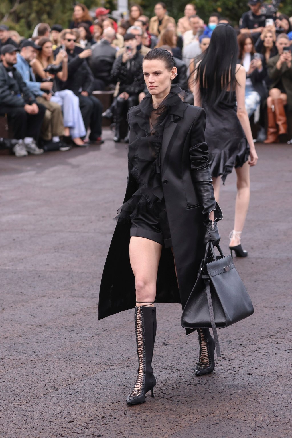 A model wears an all-black creation for the Givenchy ready-to-wear spring/summer 2023 fashion collection presented on October 2, in Paris. Photo: Invision/AP A model wears an all-black creation for the Givenchy ready-to-wear spring/summer 2023 fashion collection presented on October 2, in Paris. Photo: Invision/AP