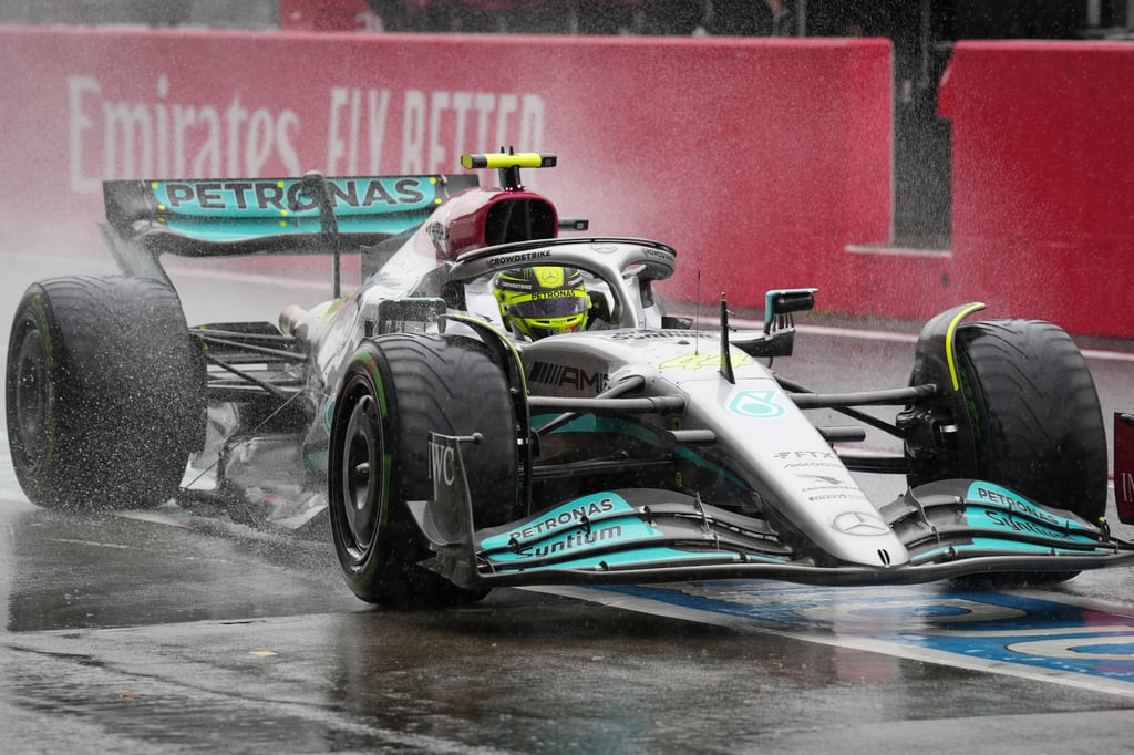 Mercedes driver Lewis Hamilton comes into the pit area during the first practice session for the Japanese Formula One Grand Prix. Photo: AP Mercedes driver Lewis Hamilton comes into the pit area during the first practice session for the Japanese Formula One Grand Prix. Photo: AP