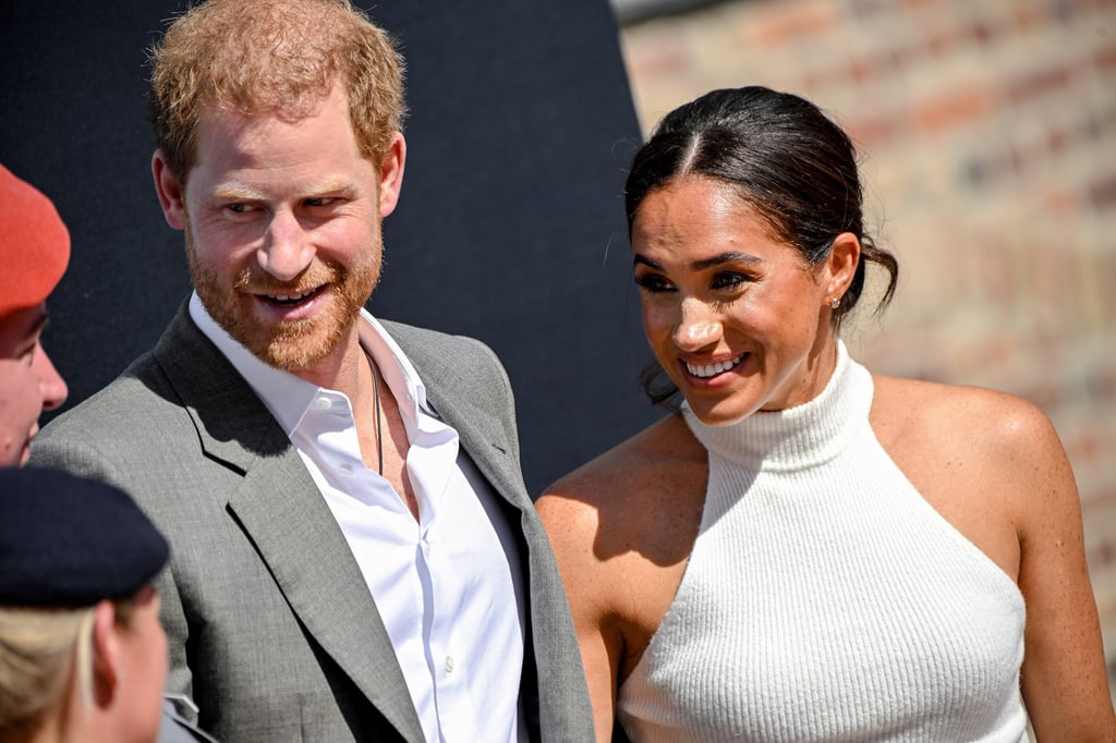 Britain’s Prince Harry and his wife Meghan Markle, the Duke and Duchess of Sussex, speak with onlookers as they arrive for their visit to represent the 6th Invictus Games 2023, in Düsseldorf, Germany, on September 6. Photo: EPA-EFE
