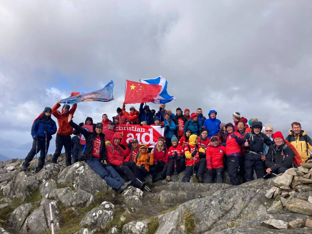 Sunny Huang is joined on the summit of the Pap of Glencoe as she completes her full house. Photo: Handout Sunny Huang is joined on the summit of the Pap of Glencoe as she completes her full house. Photo: Handout