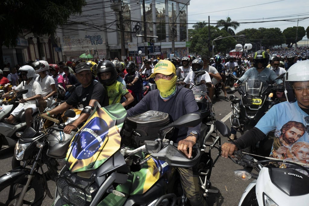 A supporter of Jair Bolsonaro rides in a motorcycle procession during the Cirio de Nazare festival in Belem, Brazil on Saturday. Photo: Bloomberg A supporter of Jair Bolsonaro rides in a motorcycle procession during the Cirio de Nazare festival in Belem, Brazil on Saturday. Photo: Bloomberg