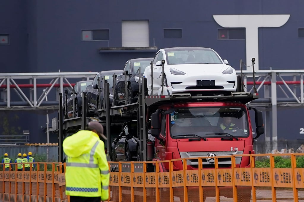 A truck transports new Tesla cars from its factory in Shanghai. Photo: Reuters