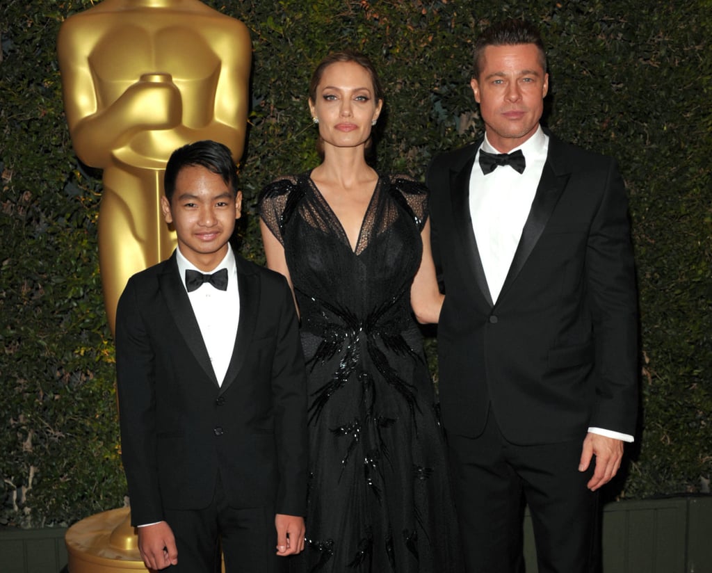 Maddox Jolie-Pitt, from left, Angelina Jolie and Brad Pitt attend the 2013 Governors Awards in Los Angeles. Photo: AP