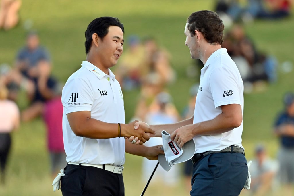 Tom Kim shakes hands with Patrick Cantlay after Kim won the Shriners Children’s Open golf tournament in Las Vegas. Photo: AP