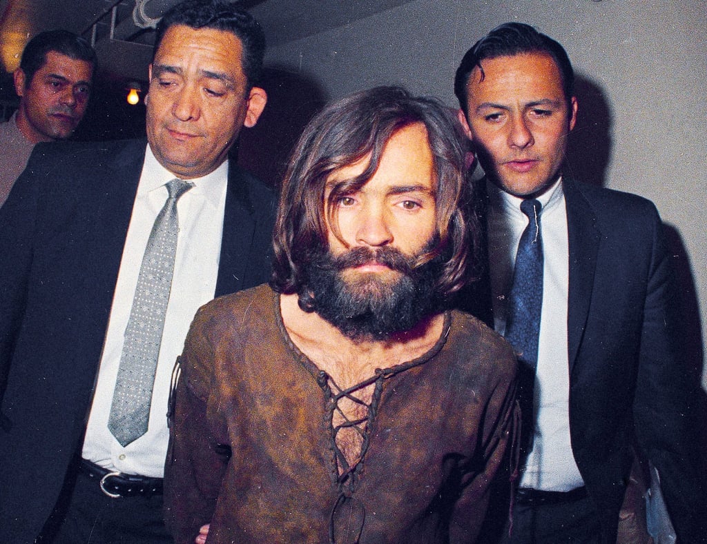 Charles Manson is escorted to his arraignment on conspiracy-murder charges in connection with the Sharon Tate murder case in Los Angeles, in 1969. Photo: AP