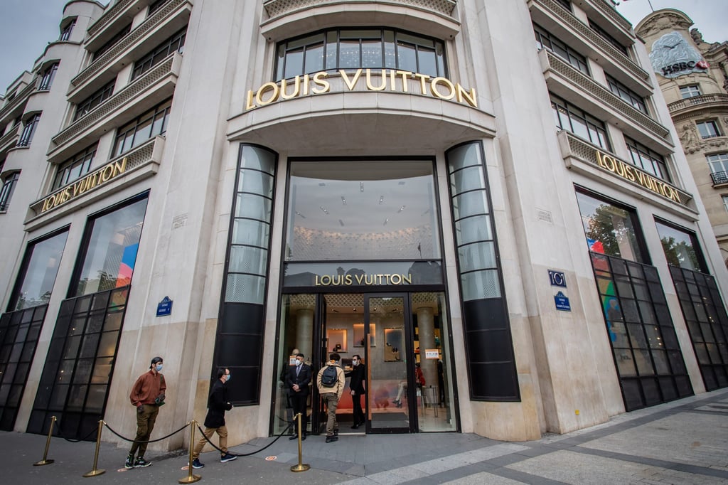 Customers wait to enter a Louis Vuitton store on the Champs Elysees Avenue in Paris, France, in May 2020. Photo: Xinhua