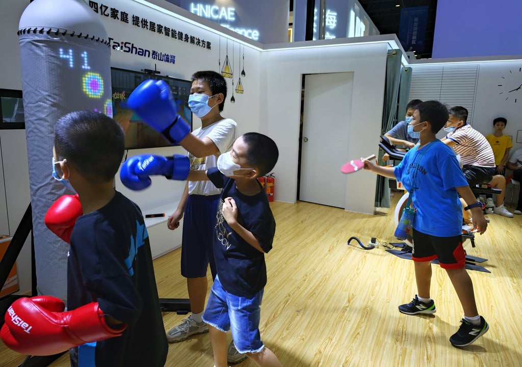 Children experience an intelligent fitness facility at the second China International Consumer Products Expo in Haikou, south China’s Hainan Province. Photo: Xinhua