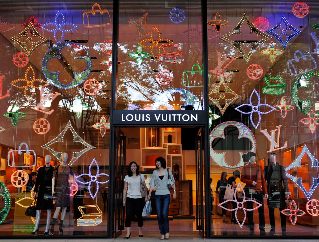 Shoppers walk out of a Louis Vuitton store at Tokyo’s Omotesando fashion district, in Japan. Photo: EPA-EFE