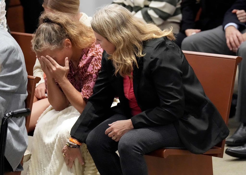 Debbie Hixon reaches out to her sister-in-law, Natalie Hixon, as the verdicts are announced in the trial of Parkland shooter Nikolas Cruz in Fort Lauderdale, Florida, on Thursday. Photo: AFP Debbie Hixon reaches out to her sister-in-law, Natalie Hixon, as the verdicts are announced in the trial of Parkland shooter Nikolas Cruz in Fort Lauderdale, Florida, on Thursday. Photo: AFP