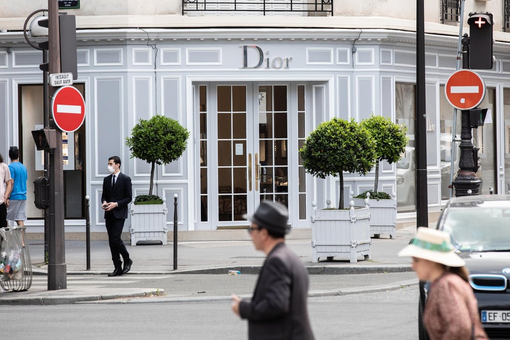Pedestrians pass the founding Christian Dior SE luxury goods store, operated by LVMH Moët Hennessy Louis Vuitton SE, on Avenue Montaigne in Paris, France. Photo: Bloomberg