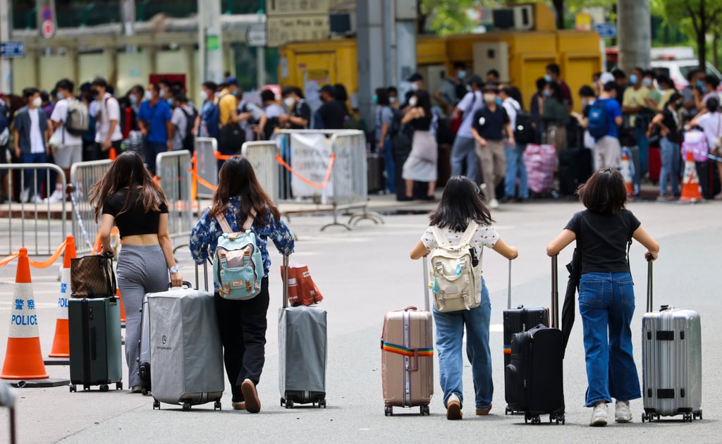 Travellers with suitcases lining up for Covid-19 PCR test at Shenzhen Bay Port in Hong Kong. Photo: Dickson Lee