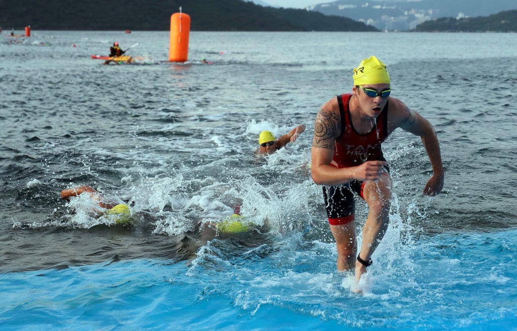 Athletes exit the water after the swim during the Hong Kong Triathlon Championships. Photo: Xiaomei Chen