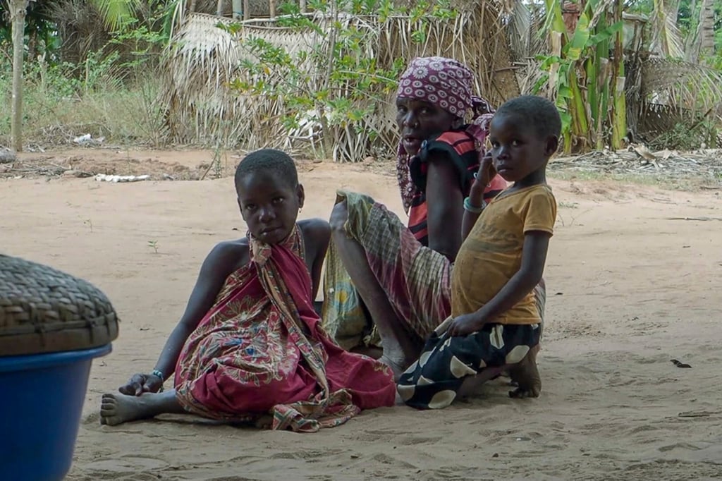 Residents watch as Rwandan soldiers patrol in the village of Mute, in Cabo Delgado province, Mozambique in August 2021. Photo: AP