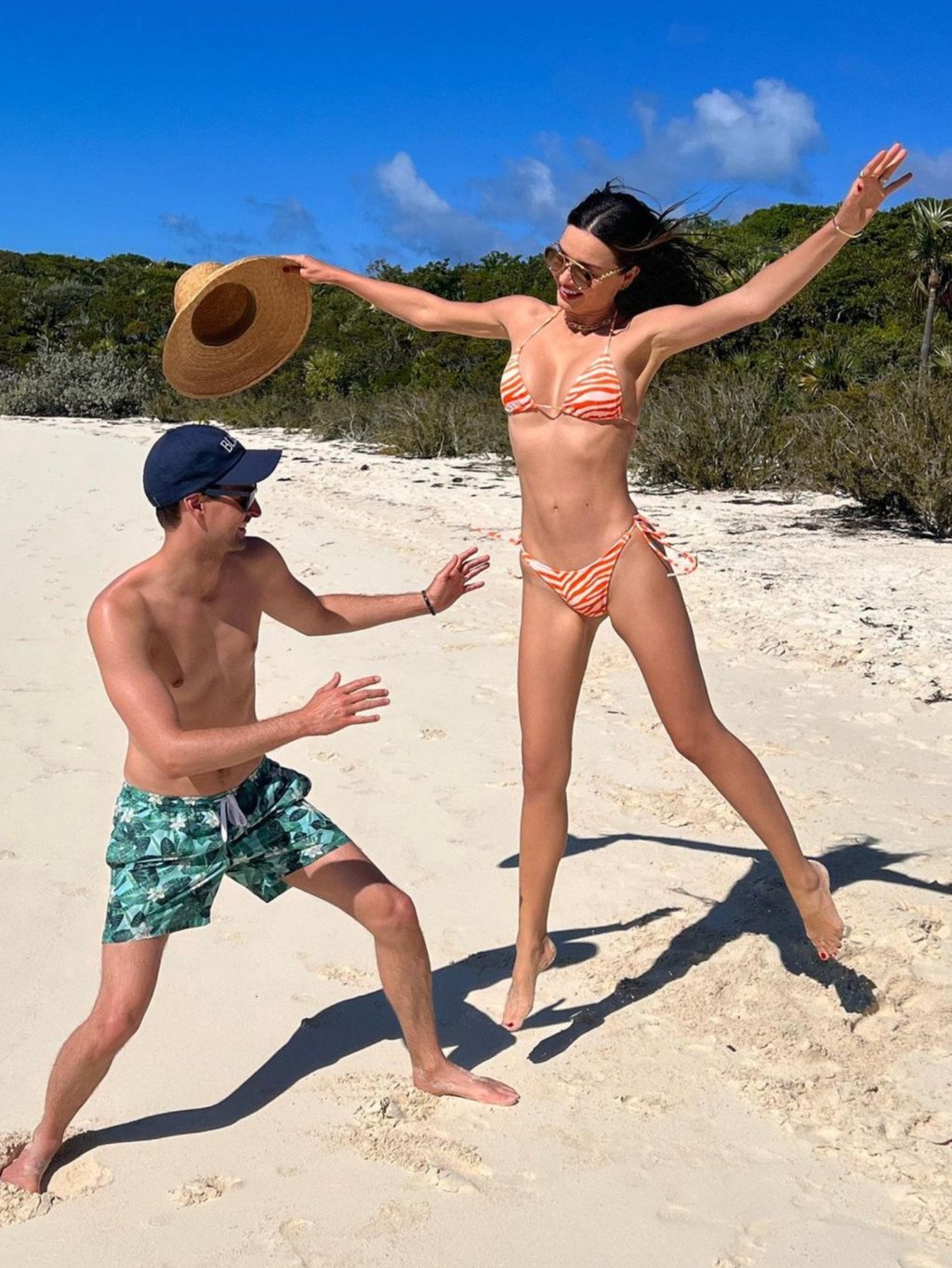 Evan Spiegel and Miranda Kerr having fun on the beach. Photo: @mirandakerr/Instagram