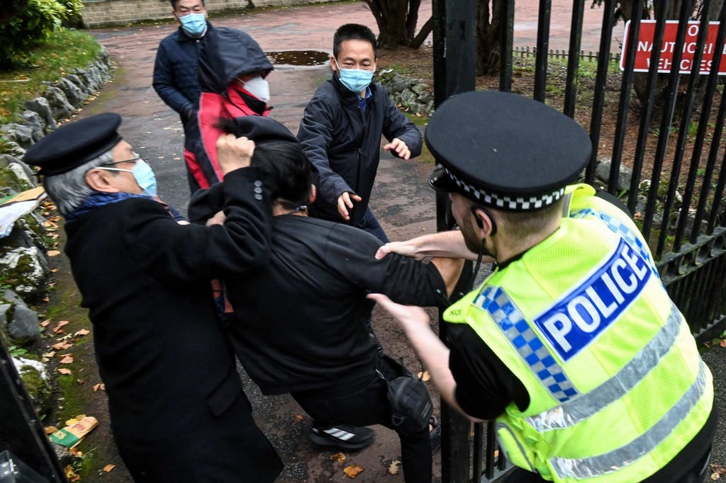 British police intervene in the scuffle at the consulate. Photo: AFP British police intervene in the scuffle at the consulate. Photo: AFP