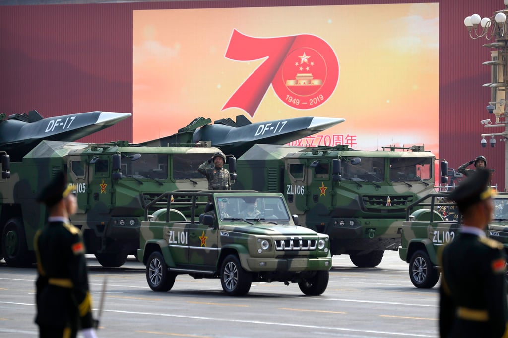 Chinese military vehicles carrying DF-17 ballistic missiles are seen at a parade to commemorate the 70th anniversary of the founding of Communist China, in Beijing on October 1, 2019. Trucks carrying weapons, including a nuclear-armed missile designed to evade US defences, were part of the parade which showcased China’s global ambitions. Photo: AP Chinese military vehicles carrying DF-17 ballistic missiles are seen at a parade to commemorate the 70th anniversary of the founding of Communist China, in Beijing on October 1, 2019. Trucks carrying weapons, including a nuclear-armed missile designed to evade US defences, were part of the parade which showcased China’s global ambitions. Photo: AP