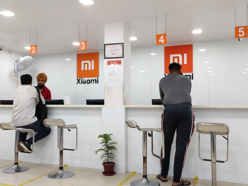 Customers are seen inside one of Xiaomi’s service centres in Delhi, the national capital territory of India. Photo: Shutterstock Customers are seen inside one of Xiaomi’s service centres in Delhi, the national capital territory of India. Photo: Shutterstock