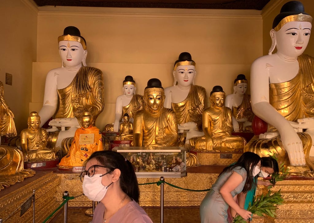 Myanmar devotees charged over sex doll stunt at holiest Buddhist shrine