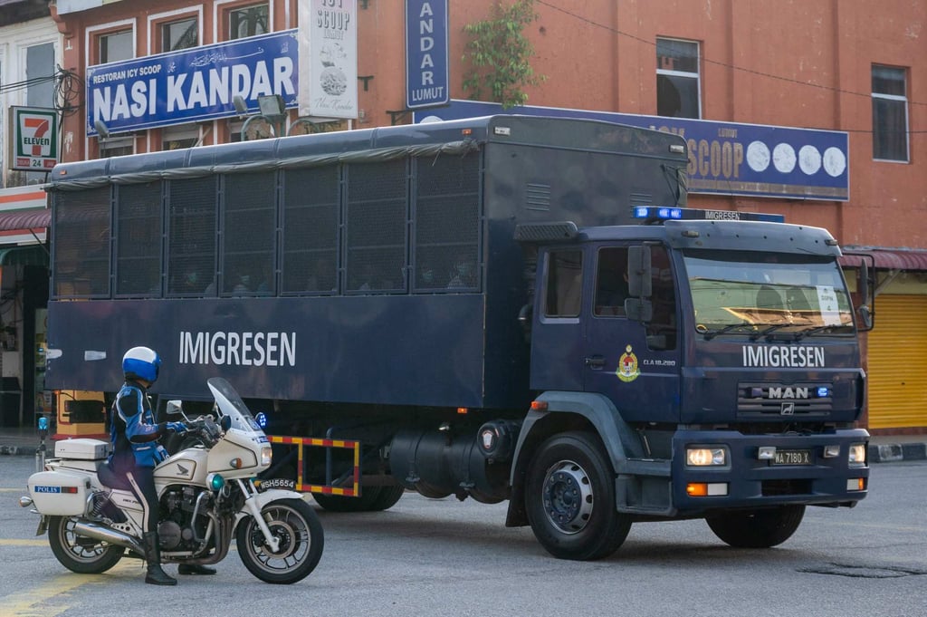 An immigration truck carrying Myanmar migrants is seen heading towards a naval base outside Kuala Lumpur last year to deport them back to their homeland. Photo: AFP