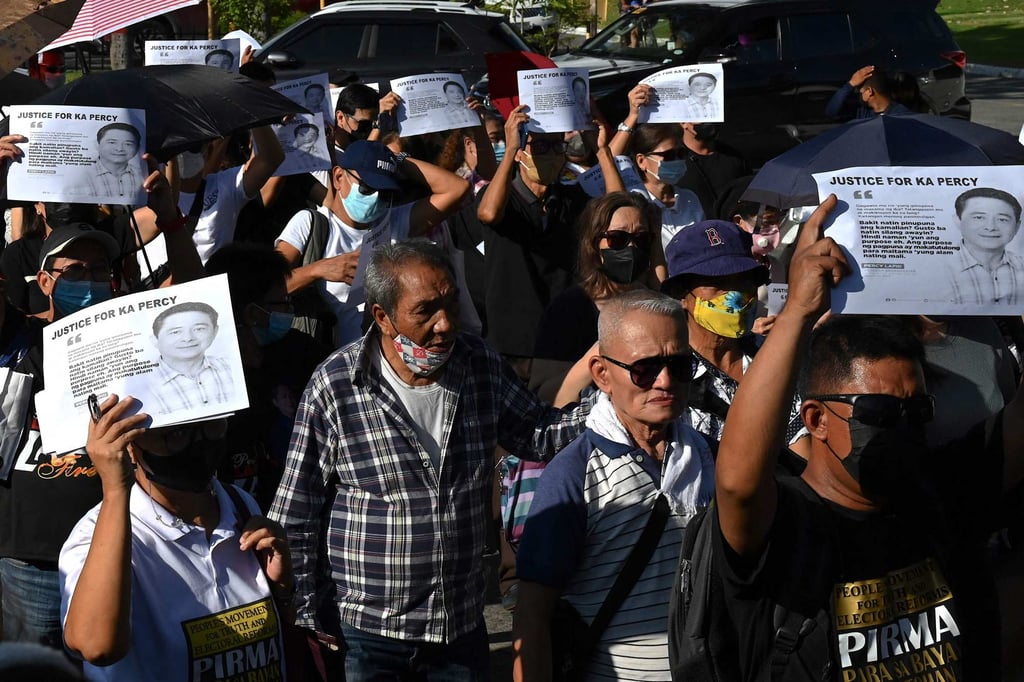 Mourners hold placards for slain journalist Percival Mabasa during his funeral in Metro Manila on October 9, 2022. Photo: AFP Mourners hold placards for slain journalist Percival Mabasa during his funeral in Metro Manila on October 9, 2022. Photo: AFP