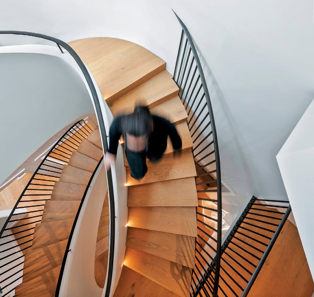 The staircase, designed by Luigi Rosselli, captivates with its curves. Photo: Desmond Chan