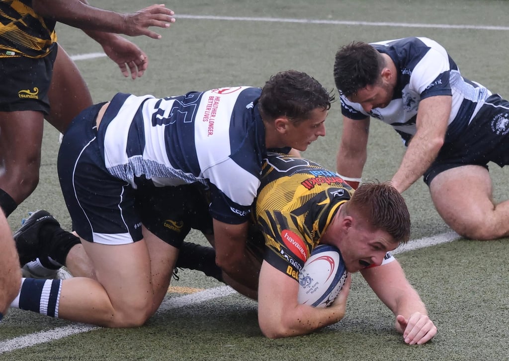 Tigers’ Tomos Howells goes over at King’s Park in Yau Ma Tei. Photo” Jonathan Wong