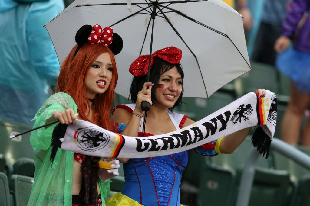 Fans take shelter from the rain during the 2016 Cathay Pacific/HSBC Hong Kong Sevens. Photo: K.Y. Cheng