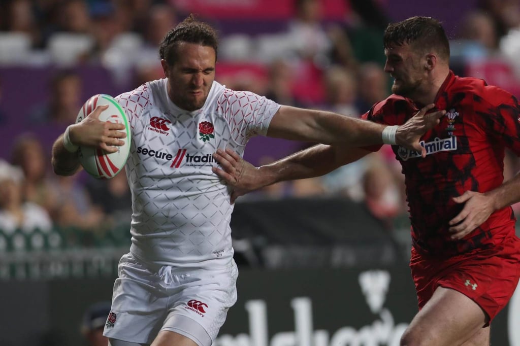 Mike Ellery (left) of England in action against Wales on the first day of the 2019 Hong Kong Sevens. Photo: Winson Wong