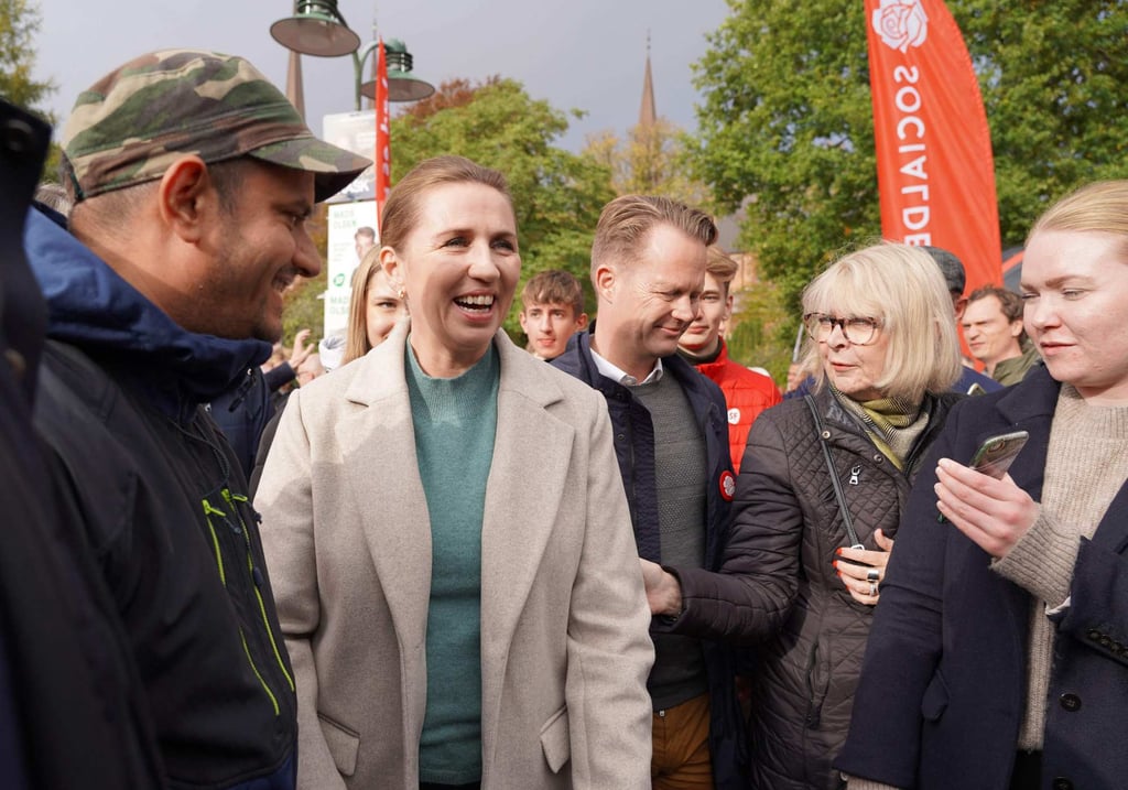 Mette Frederiksen (centre), Danish Prime Minister and leader of the Social Democrats, meets voters as she campaigns in Roskilde, Denmark, earlier this month. Photo: AFP