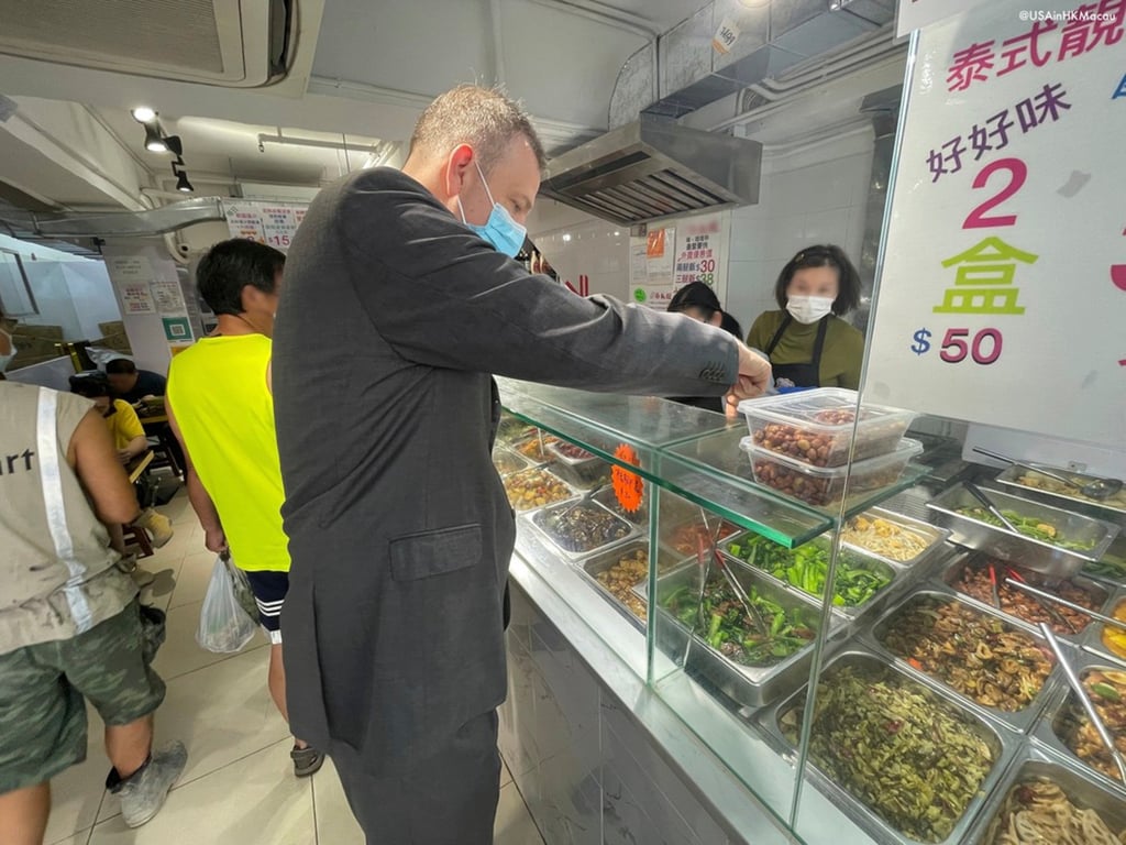 US Consul General Gregory May purchases a lunch box in Hong Kong. Photo: Facebook/Gregory May US Consul General Gregory May purchases a lunch box in Hong Kong. Photo: Facebook/Gregory May