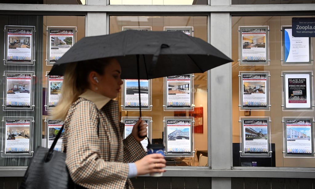 A woman walks past property advertisements at an estate agent’s in London, on November 3, 2022, the same day The Bank of England November raised its interest rates by 75 basis points to 3 per cent. Photo: EPA-EFE A woman walks past property advertisements at an estate agent’s in London, on November 3, 2022, the same day The Bank of England November raised its interest rates by 75 basis points to 3 per cent. Photo: EPA-EFE
