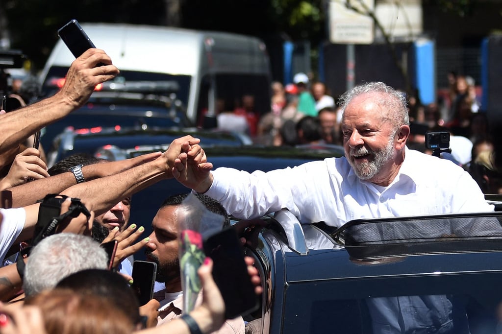 Luiz Inácio Lula da Silva greets supporters while leaving the polling station during the presidential run-off election in Sao Paulo, Brazil, on October 30, 2022. Photo: AFP via Getty Images Luiz Inácio Lula da Silva greets supporters while leaving the polling station during the presidential run-off election in Sao Paulo, Brazil, on October 30, 2022. Photo: AFP via Getty Images