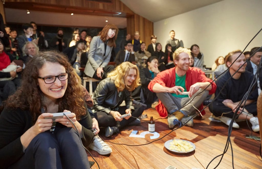 Visitors play exhibition games at “Video Game Cohabitant” in 2018, a gaming exhibition curated by Allison Yang, in Shenzhen, southern China, in 2018. Photo: Allison Yang
