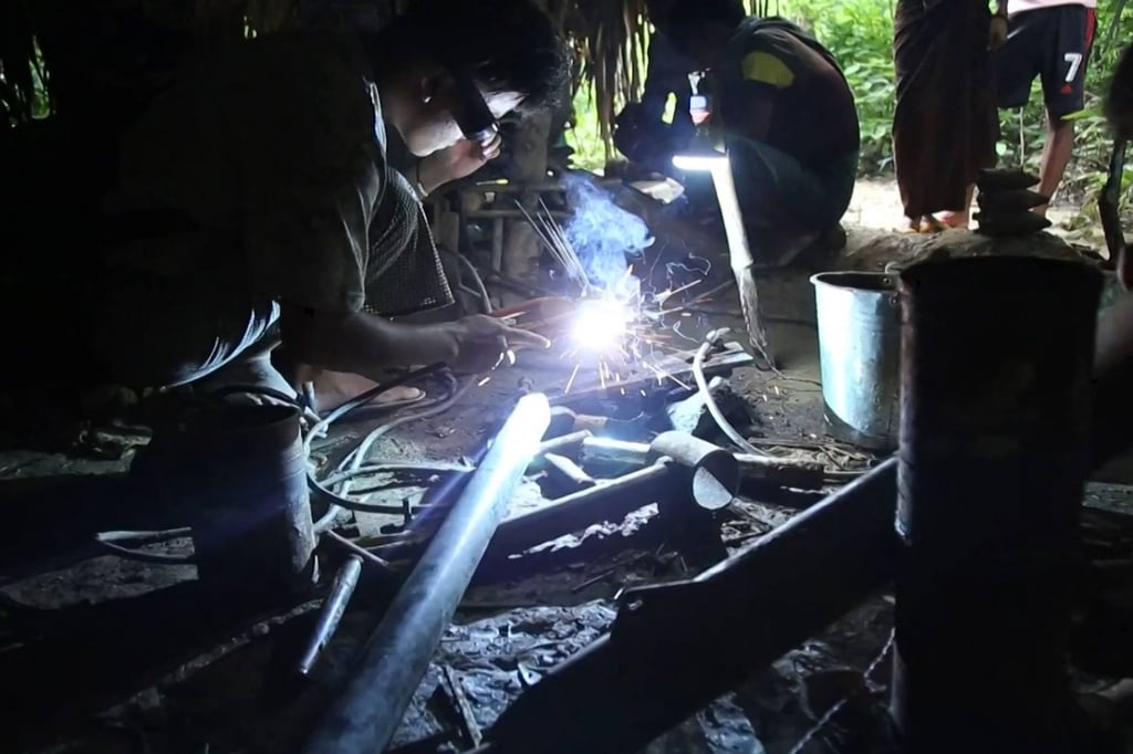 Members of the Pale People Defence Force (Pale PDF) produce home-made weapons at a workshop in Myanmar. Photo: AFPTV/AFP