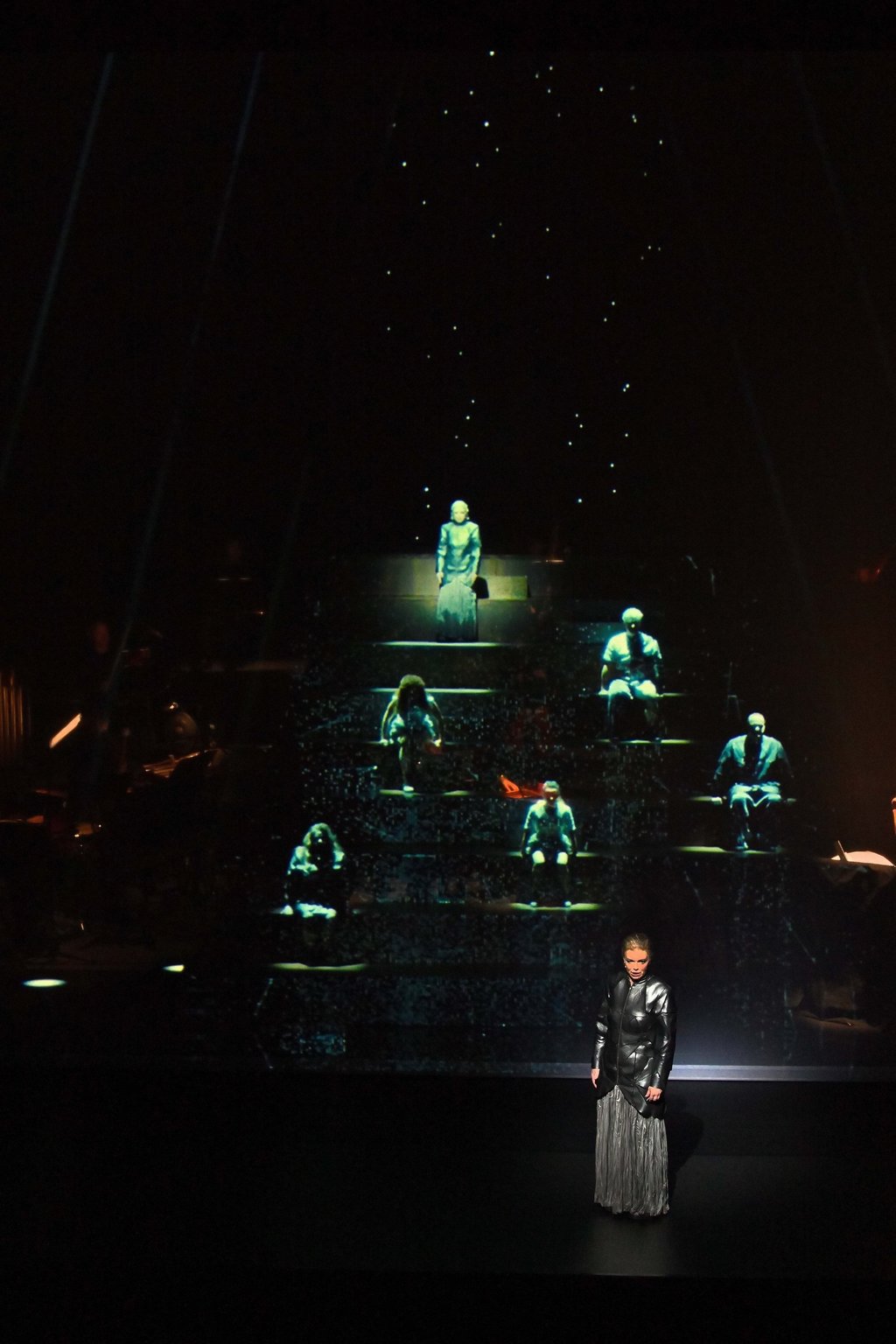 Digital projections of the German cast, and soprano Eir Inderhaug performing live in Hong Kong. Photo: New Vision Arts Festival Digital projections of the German cast, and soprano Eir Inderhaug performing live in Hong Kong. Photo: New Vision Arts Festival