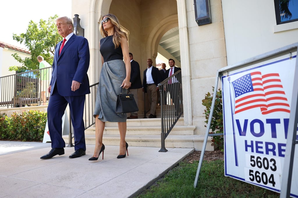 Former US President Donald Trump and former first lady Melania Trump walk together after voting at a polling station set-up in the Morton and Barbara Mandel Recreation Center on November 8, in Palm Beach, Florida. Photo: Getty Images/AFP
