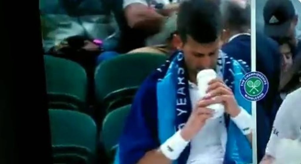 Novak Djokovic drinking from his water bottle at a tournament. Photo: @DamianReilly/Twitter Novak Djokovic drinking from his water bottle at a tournament. Photo: @DamianReilly/Twitter