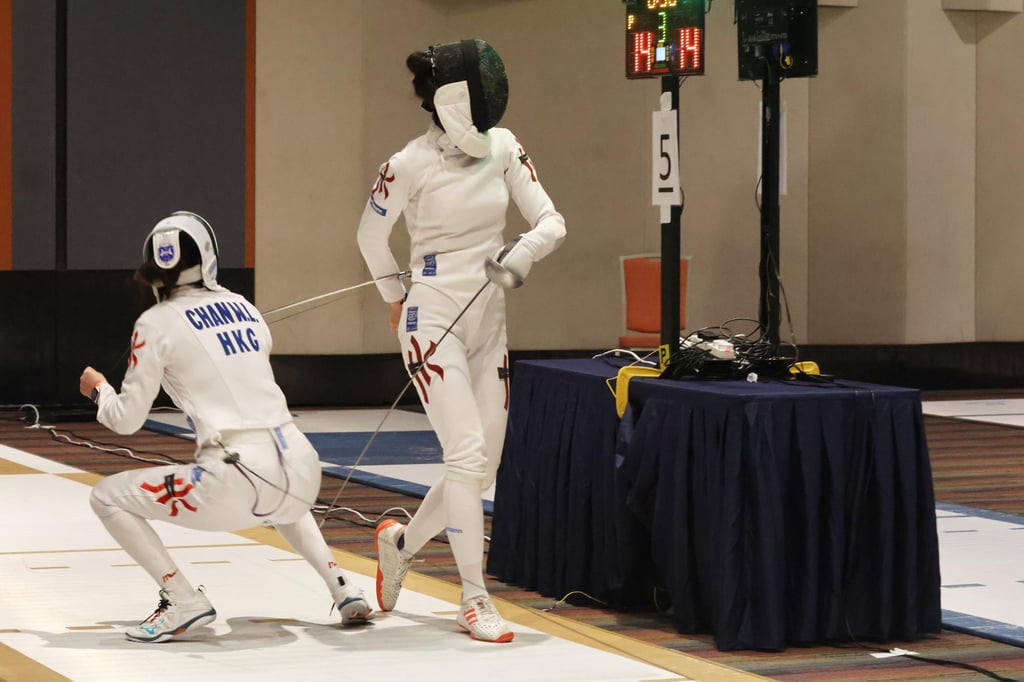 Vivian Kong (right) and Natalie Chan compete in the final of the Challenge Cups Fencing Championships at Science Park. Photo: Shirley Chui