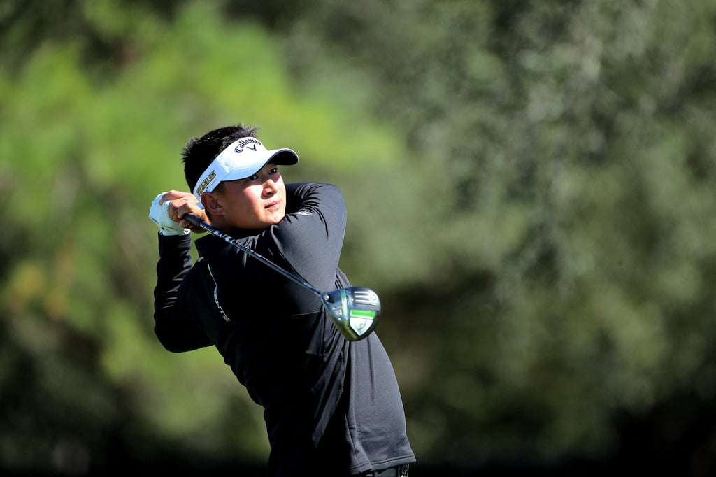 Carl Yuan of China takes a tee shot on the first hole during the third round. Photo: USA TODAY Sports