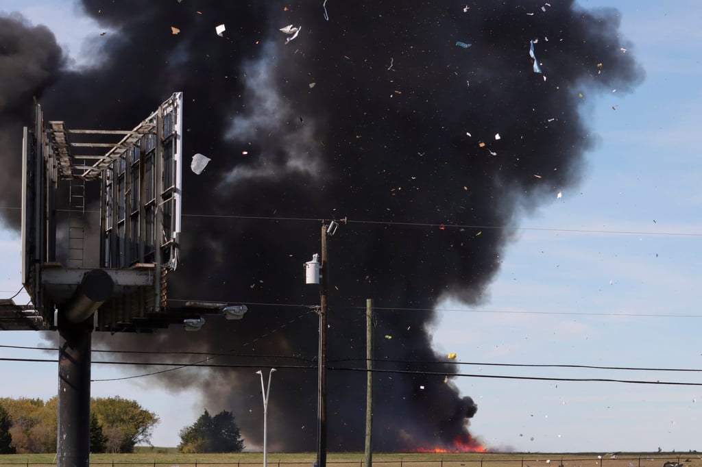 A historic military plane crashes after colliding with another plane during an air show at Dallas Executive Airport in Dallas, Texas on Saturday. Photo: Nathaniel Ross Photography via AP