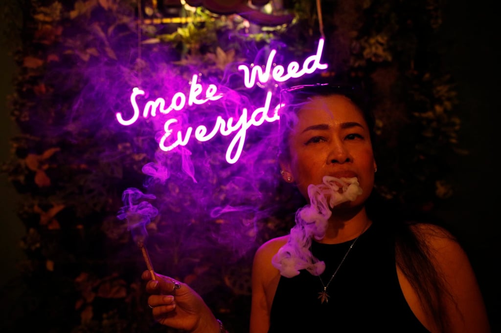 A Thai woman smokes cannabis at a coffeeshop and smoking lounge in Bangkok last month. Photo: EPA-EFE