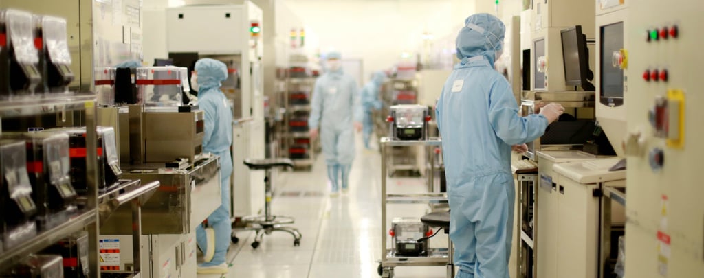 Workers are seen inside a clean room of a production facility run by Semiconductor Manufacturing International Corp, mainland China’s largest and most advanced contract chip maker. Photo: Handout Workers are seen inside a clean room of a production facility run by Semiconductor Manufacturing International Corp, mainland China’s largest and most advanced contract chip maker. Photo: Handout