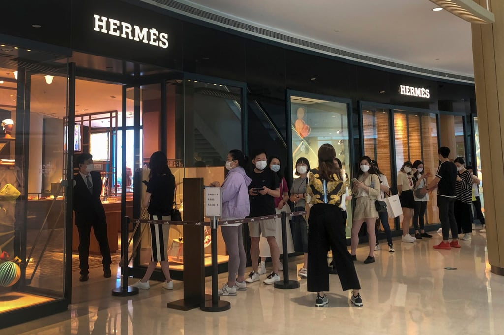 Shoppers queue to visit an Hermès store at a reopened shopping mall after it was closed for months due to Covid-19 in Shanghai, China, on May 29, 2022. Photo: AP