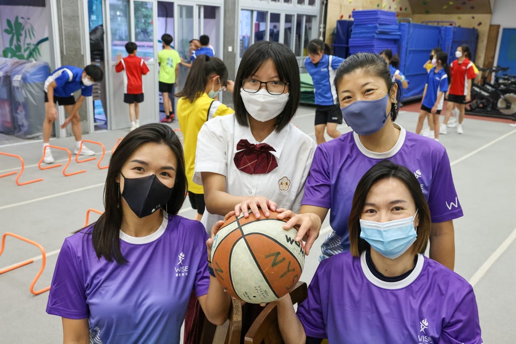 Emma Yung (centre) has found an escape from daily troubles through sport. Photo: K. Y. Cheng Emma Yung (centre) has found an escape from daily troubles through sport. Photo: K. Y. Cheng
