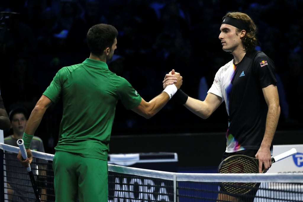 Novak Djokovic shakes hands with Stefanos Tsitsipas. Photo: Xinhua
